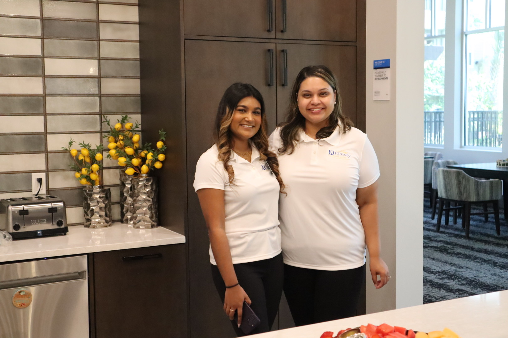 Members of the Dynasty Senior Care family at a community gathering