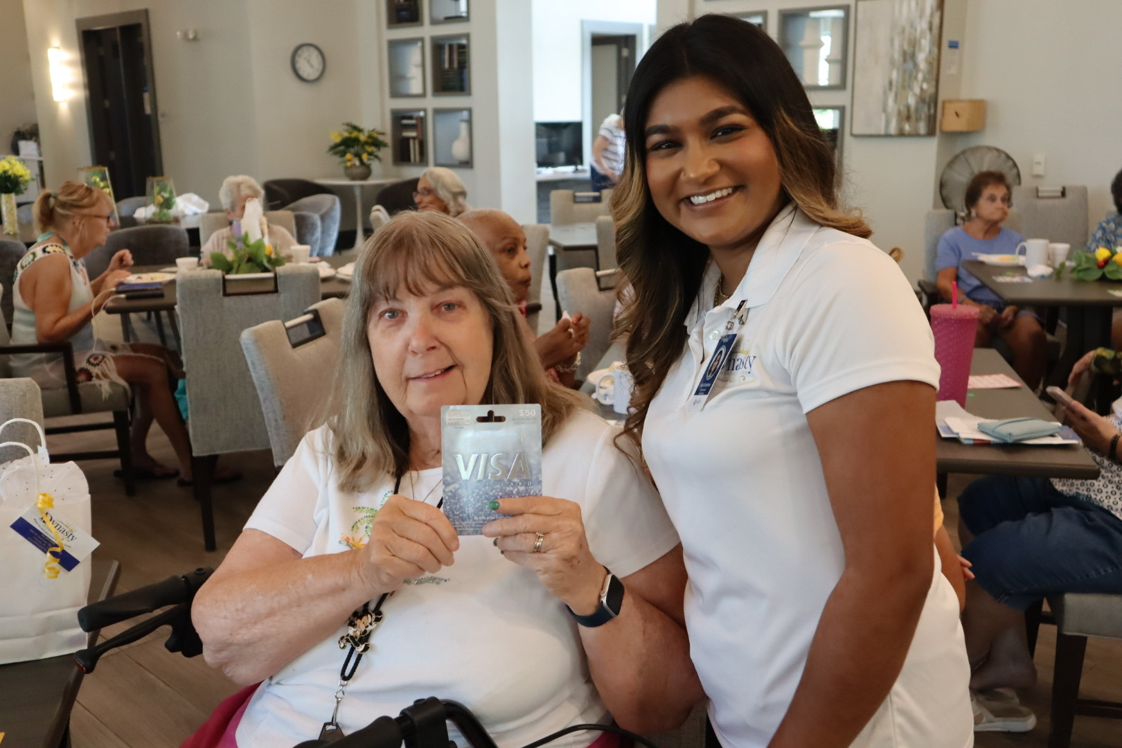 A Dynasty Senior Care team member celebrating with a bingo winner