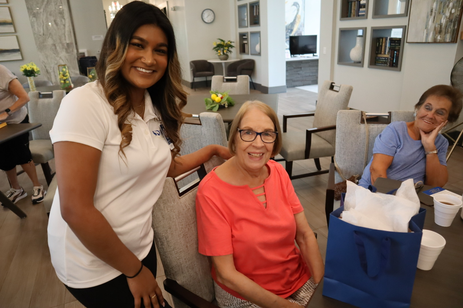 A Dynasty Senior Care team member with a smiling community guest