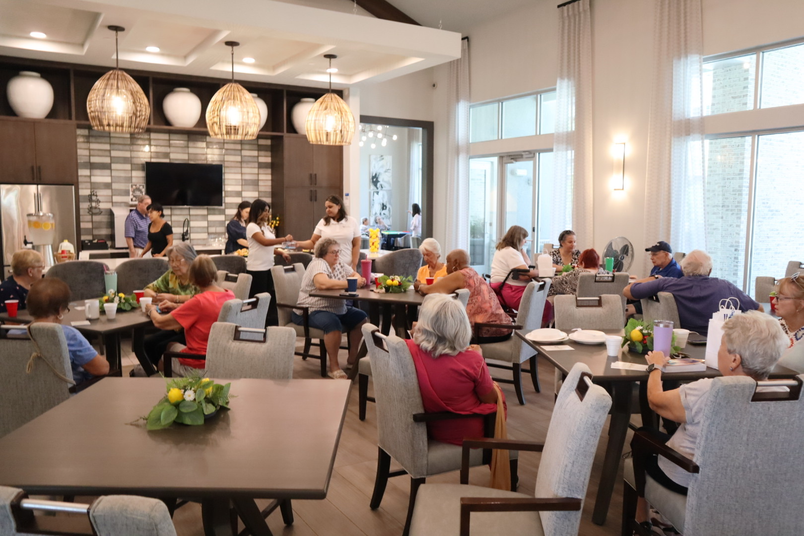 Seniors and Dynasty team members gathered in a community room